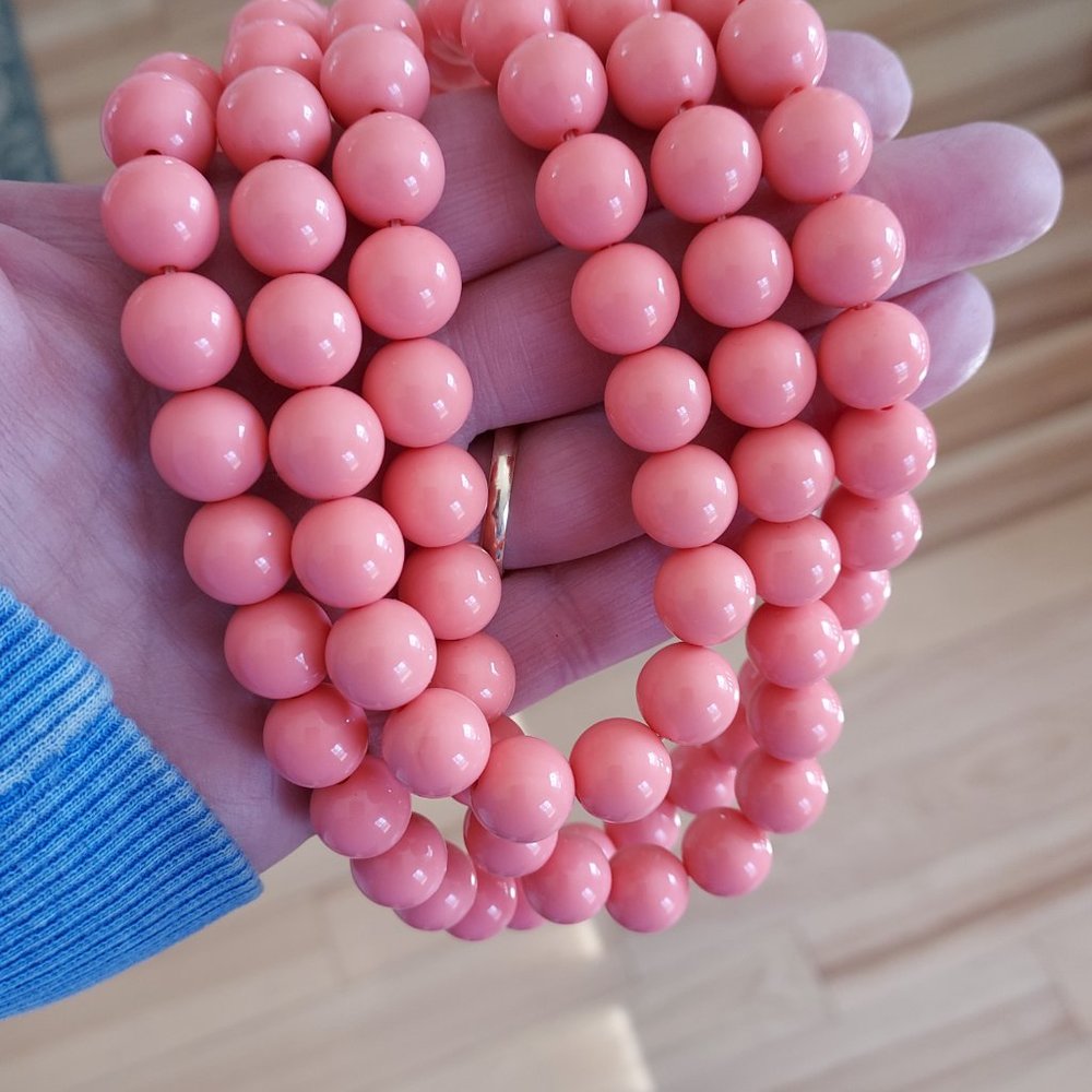 Coral colored three strand graduated  plastic ball necklace